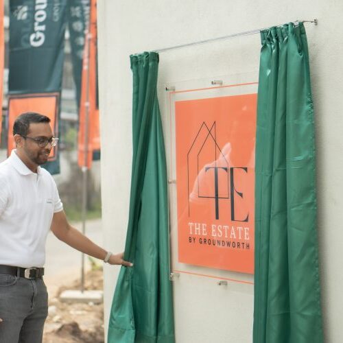 unveiling an the estate project plaque mounted on a wall