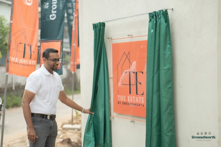 unveiling an the estate project plaque mounted on a wall